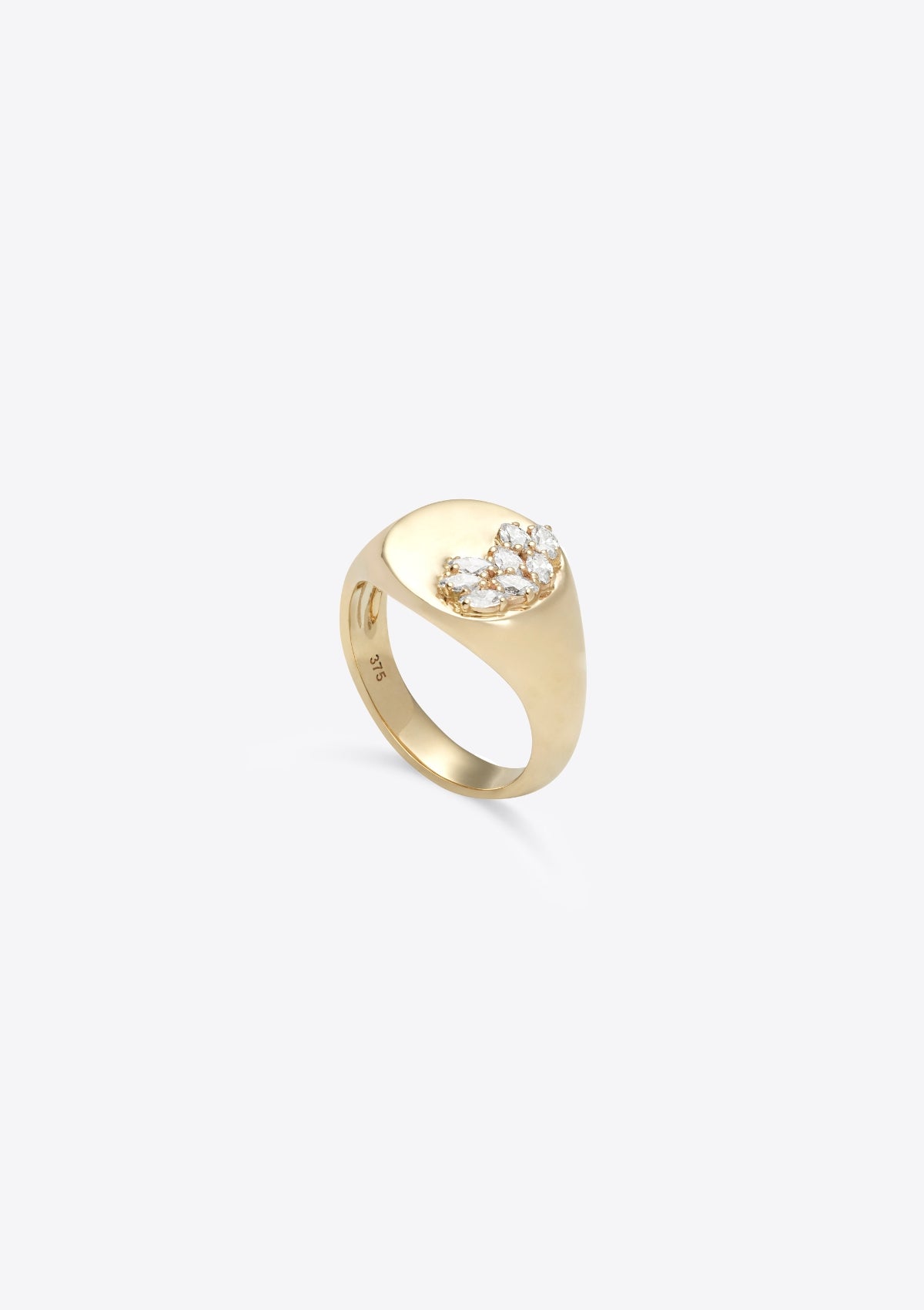 round gold signet ring, 8 small marquise diamonds across half the face, the other half plain gold. front on against a grey background