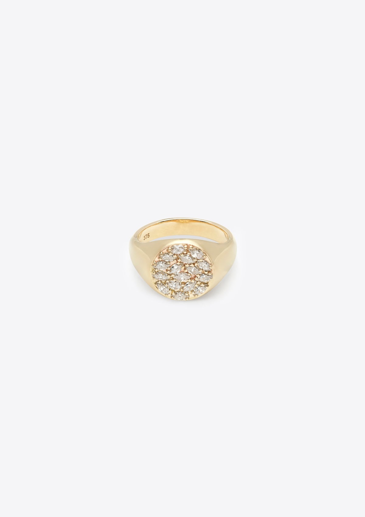 round gold signet with the face covered in closely set marquise diamonds. front on, grey background