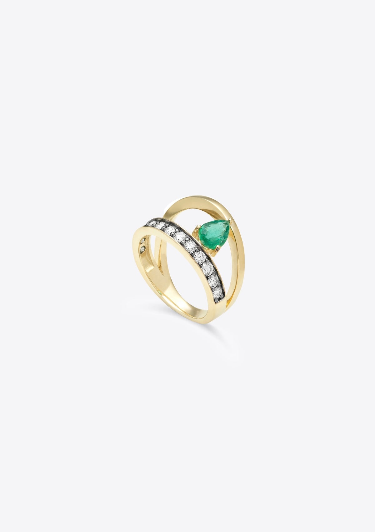 ring that has diamond-set gold band with a plain gold band asymmetrically above, joined by a pear emerald. top down view, on grey background
