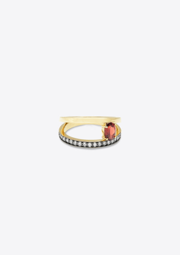 ring with diamond-set gold band with a plain gold band asymmetrically above, joined by an oval garnet. front on, on grey background