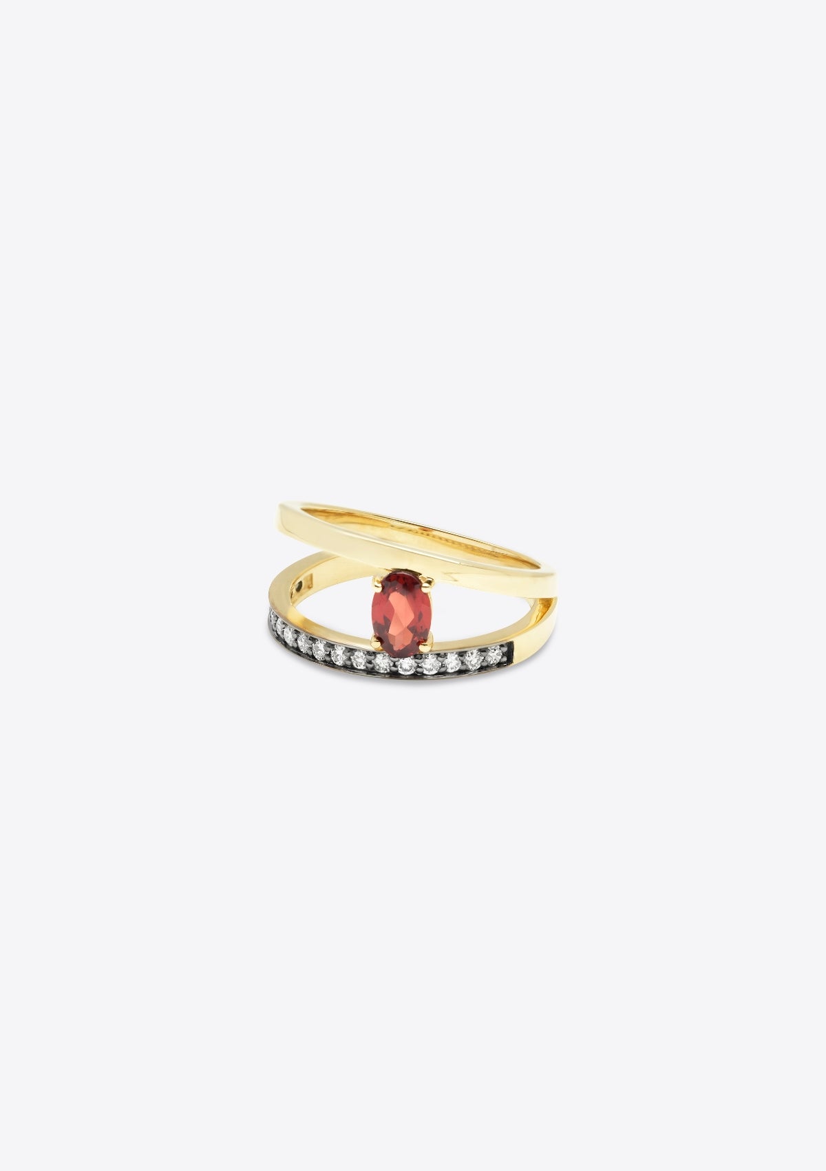ring with diamond-set gold band with a plain gold band asymmetrically above, joined by an oval garnet. front on, on grey background