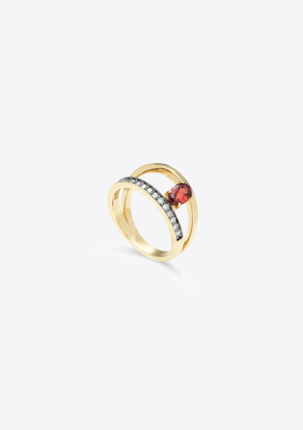 garnet ring with 2 asymmetric bands, one of them diamond-set. top down view, on grey background