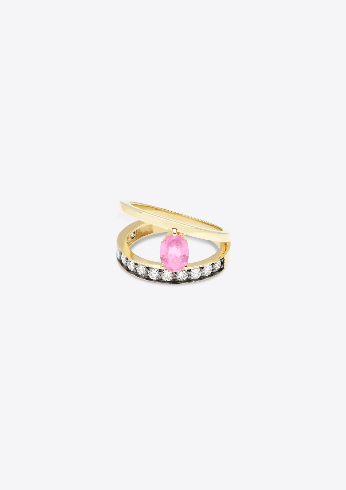 ring with diamond-set gold band, asymmetric plain band above, joined by an oval pink sapphire. top down view, grey background