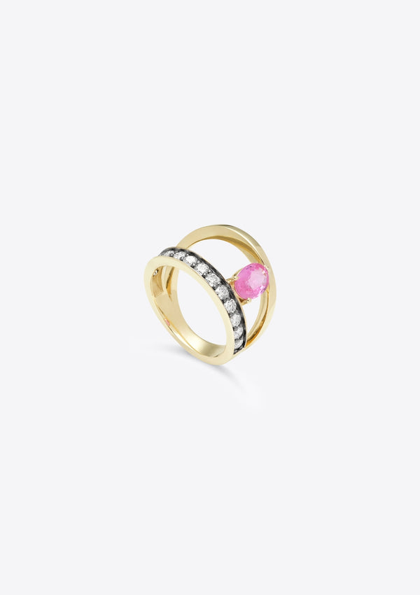 ring with diamond-set gold band, asymmetric plain band above, joined by an oval pink sapphire. top down view, grey background