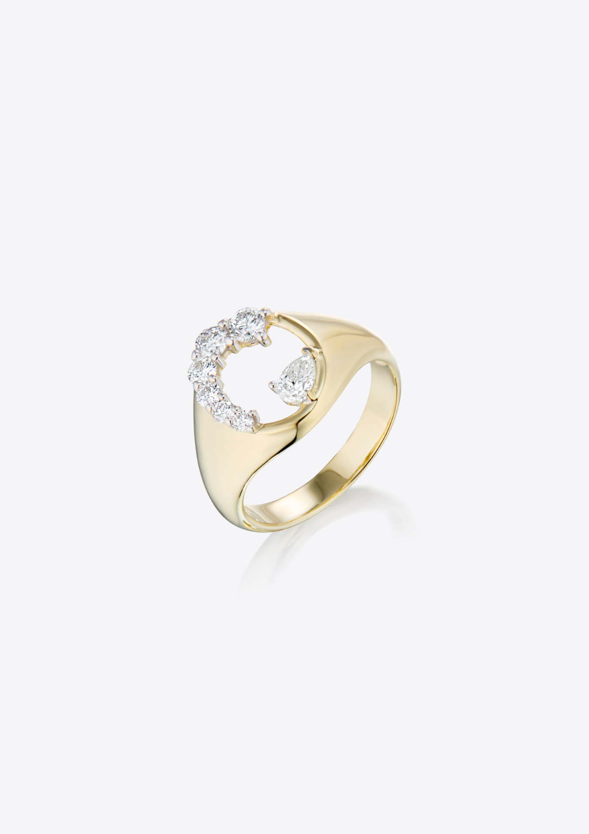 top view of a gold ring with diamonds and and negative space on the face of the ring