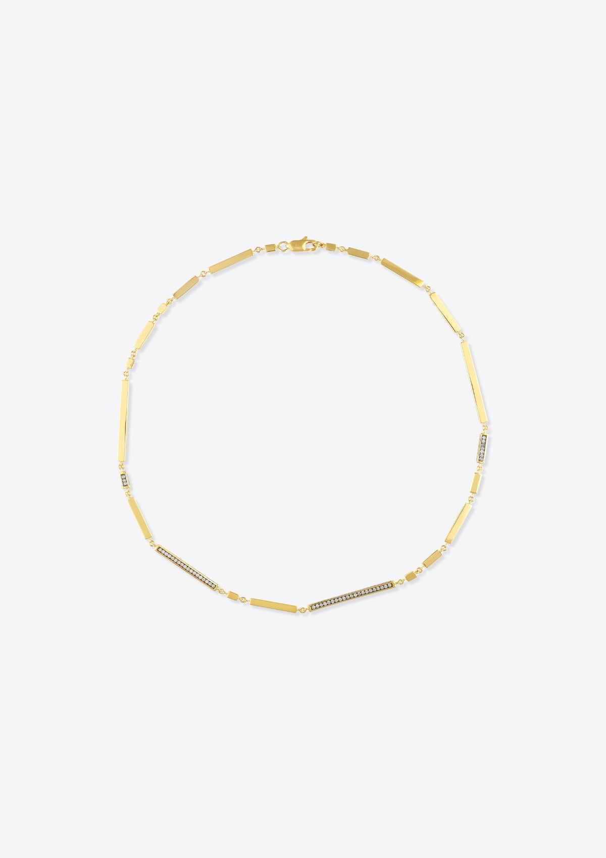 Necklace with gold bars and diamonds on a grey background