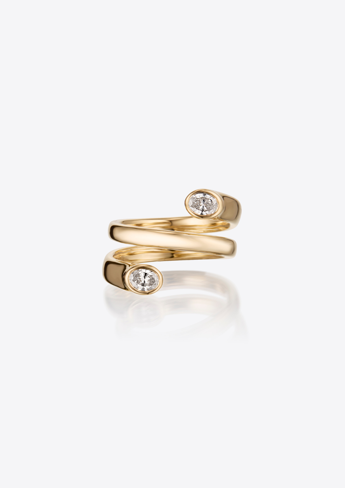 Gold ring in coil formation with 2 oval diamonds