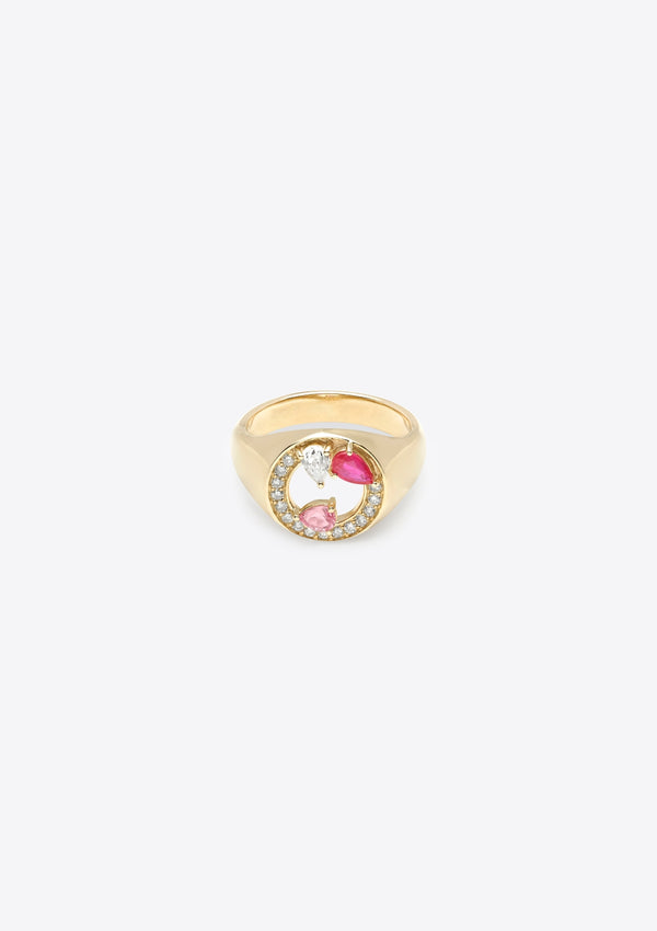 front view of gold signet ring with asymmetric pink sapphires and diamonds in pear shape and round shape