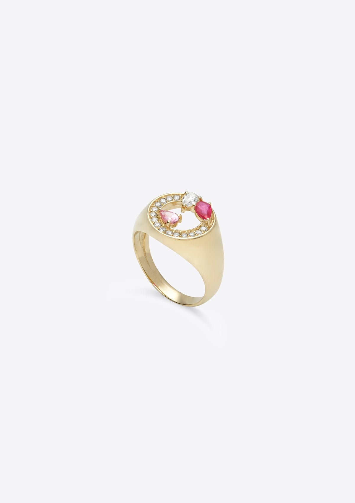 side view of gold signet ring with asymmetric pink sapphires and diamonds in pear shape and round shape on grey background