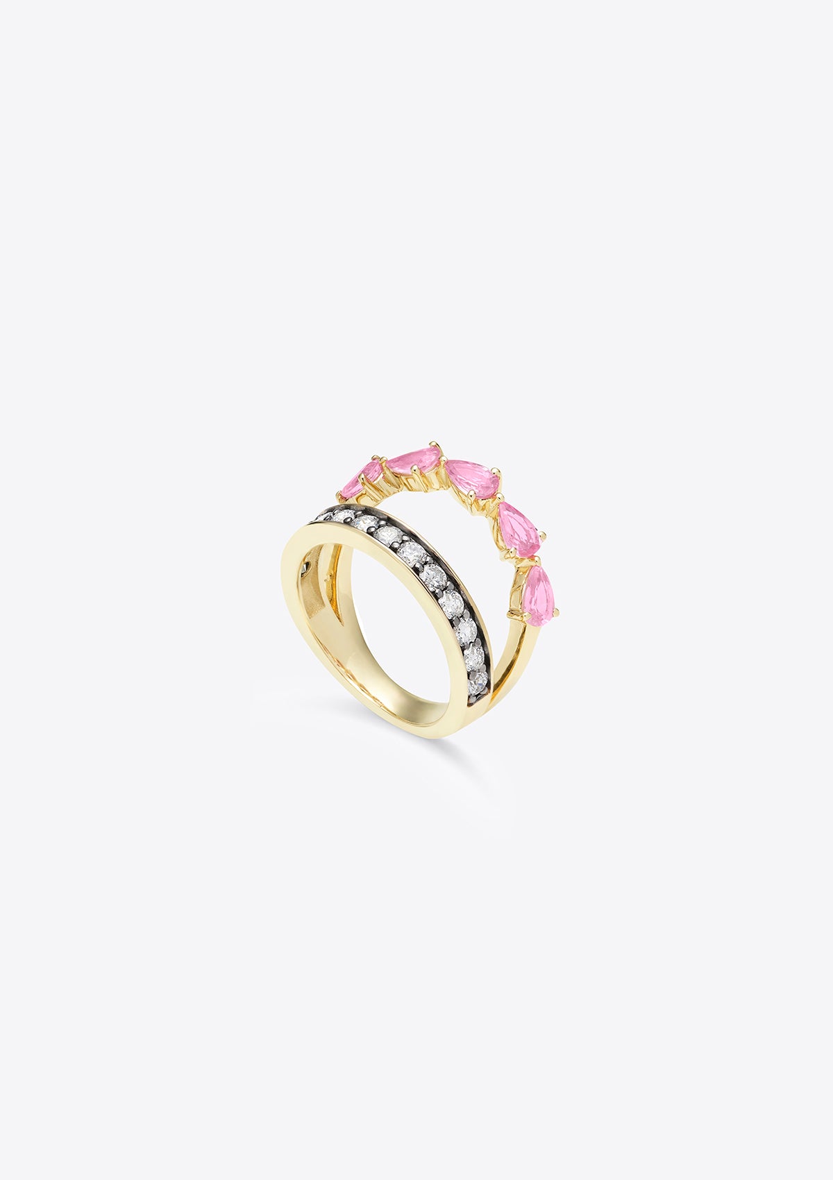 side view of gold ring with 2 joining bands with pink sapphires and round diamonds on grey background