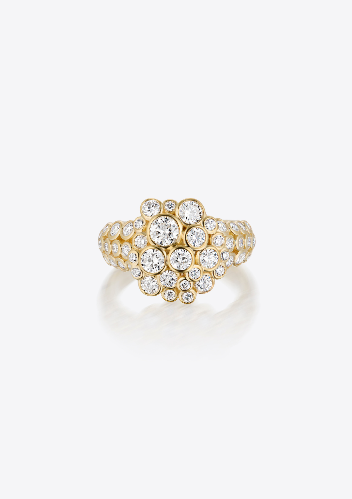 gold ring with round-cut diamonds of different sizes clustered together in a circular formation and diamonds on the band