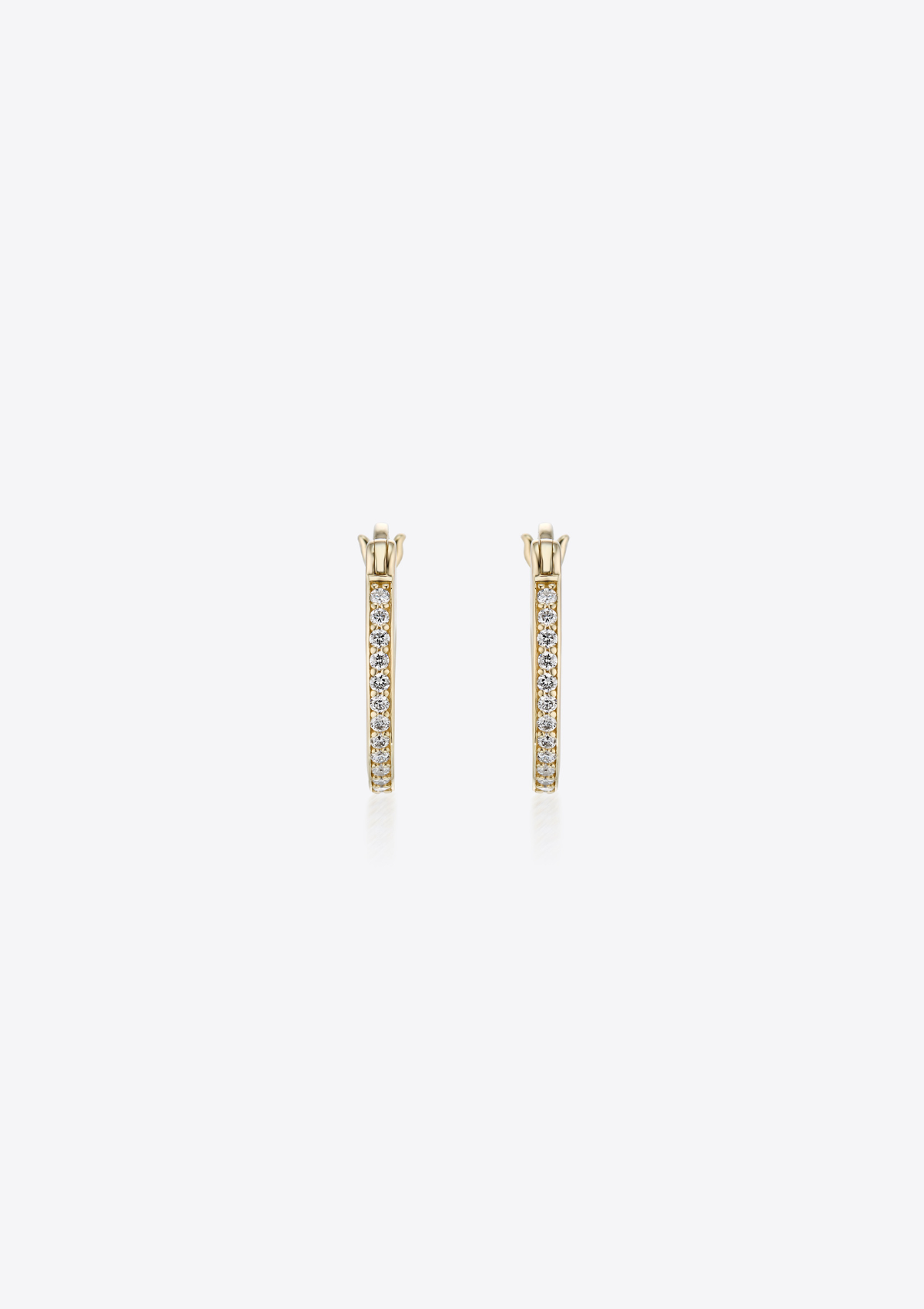 front view of gold hoop earrings with small diamonds on a grey background