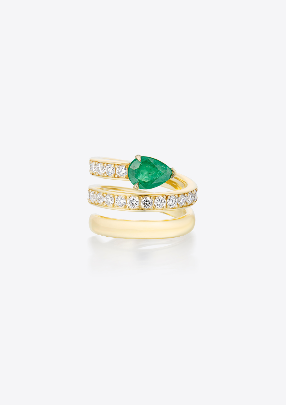 Front view of yellow gold multi band ring with small diamonds and a pear-shaped emerald on a grey background