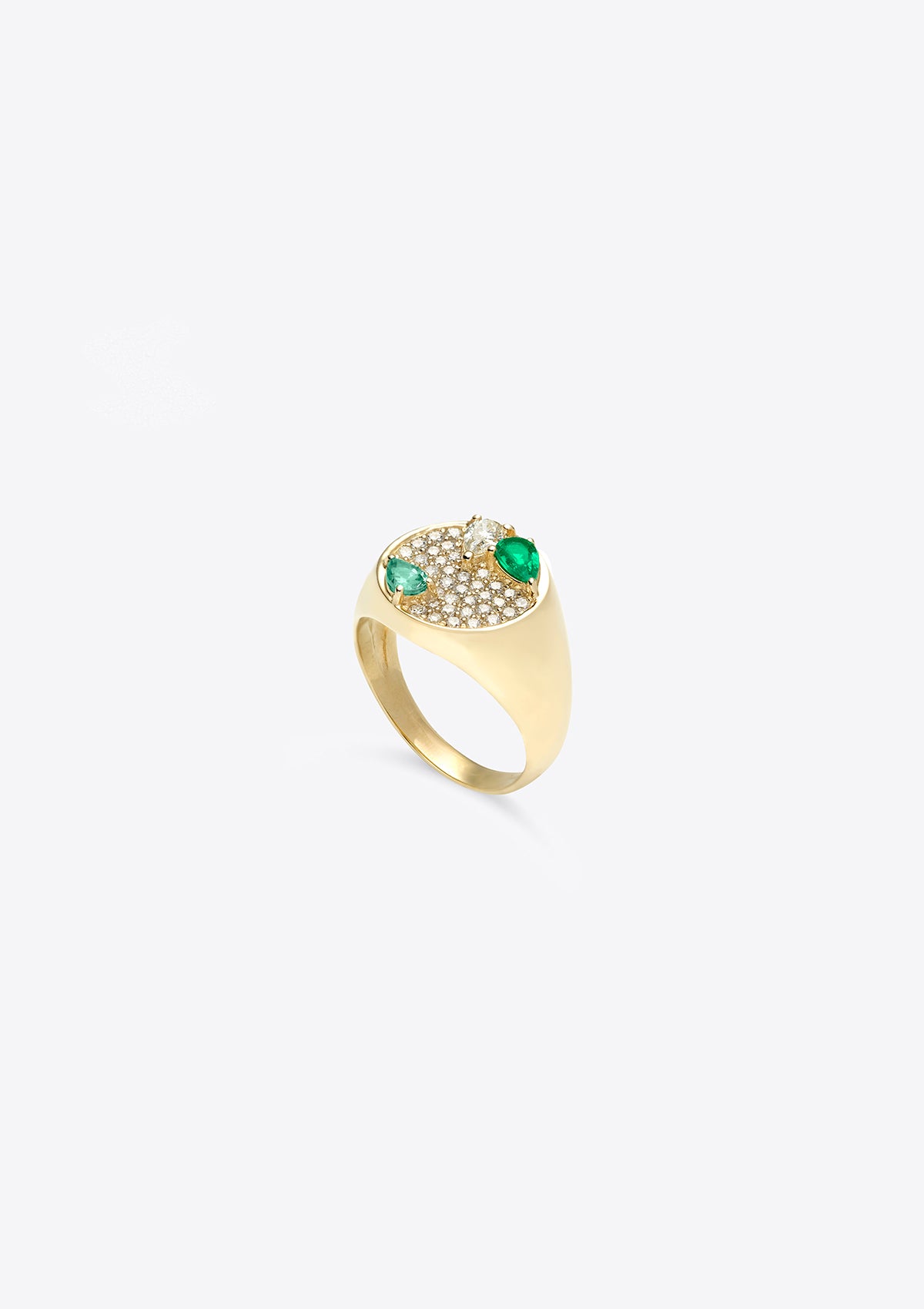 Side view of yellow gold signet ring with diamonds and pear-shaped emeralds on a grey background