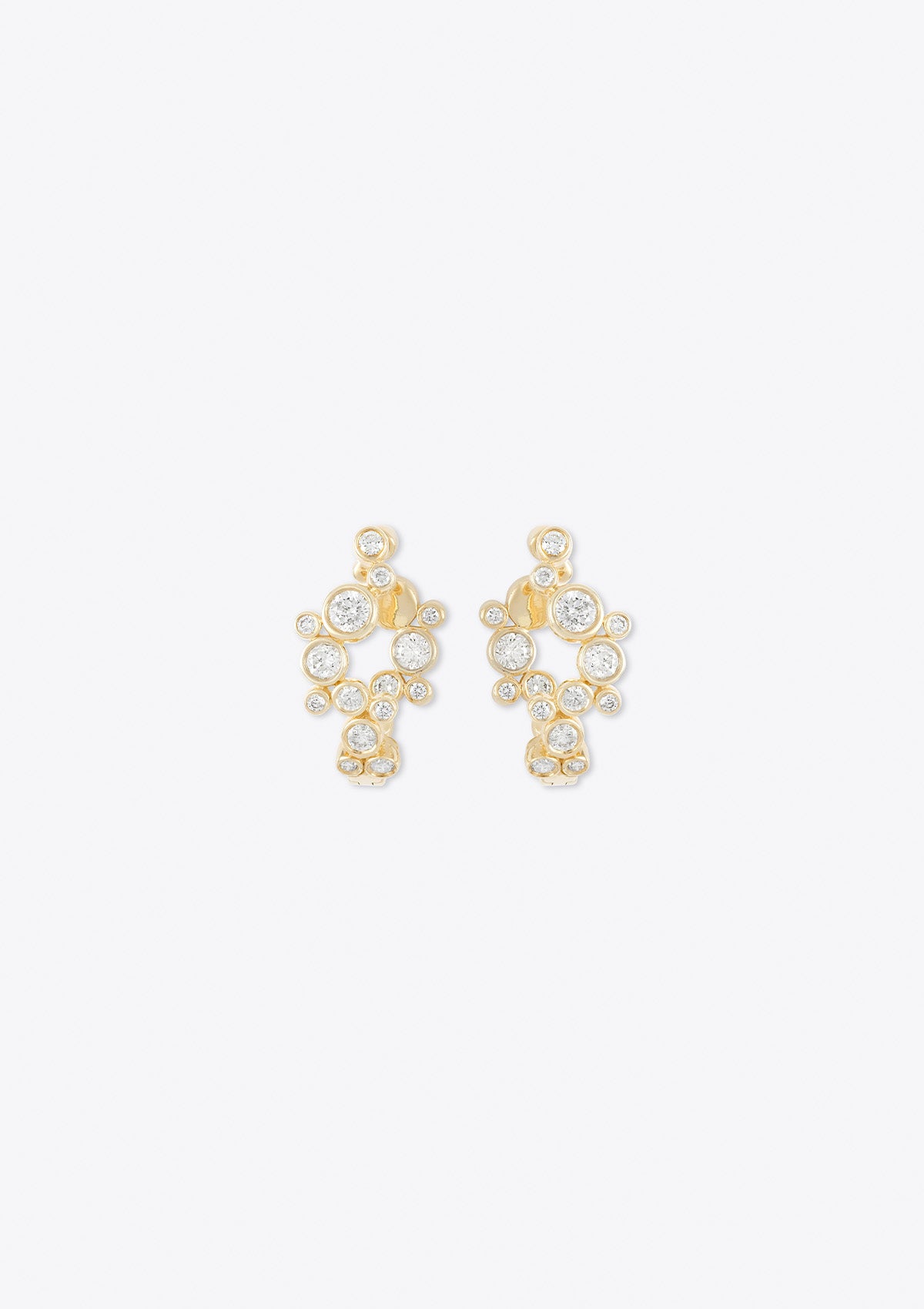 front view of yellow gold round diamond hoop earrings in an asymmetric curve design on a grey background